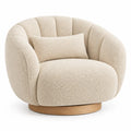 Curved beige and brown upholstered armchair with rounded contours, modern design by Pediment and Plinth.